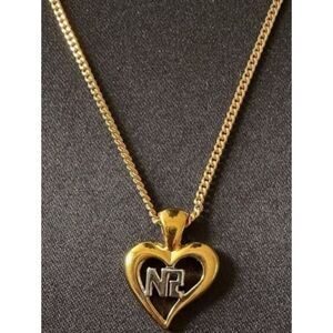 Nina Ricci gold-tone heart pendant necklace.